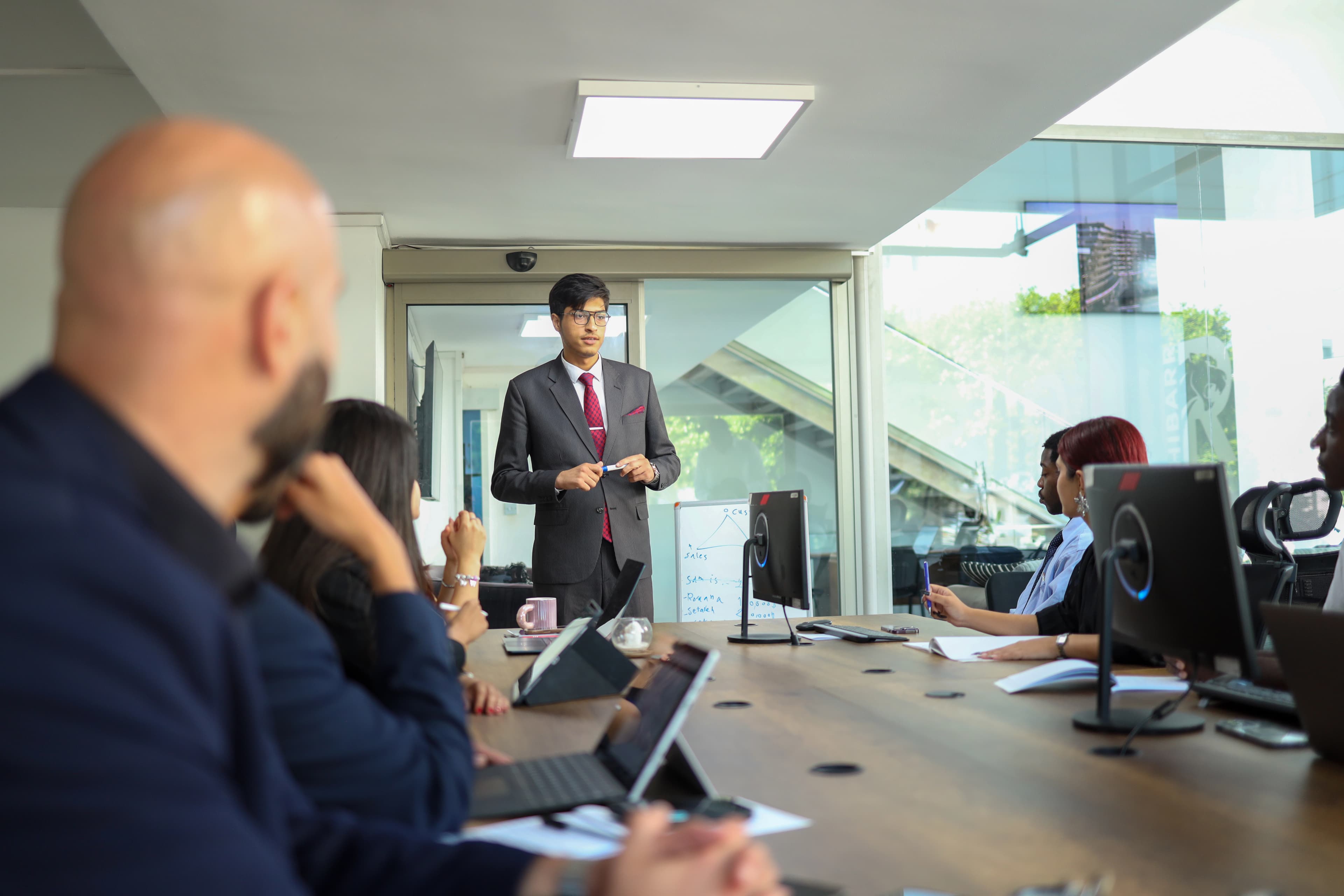 Team meeting in a boardroom discussing strategy